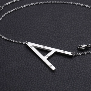 Silver A-letter necklace with rhinestones on stainless steel chain over black leather