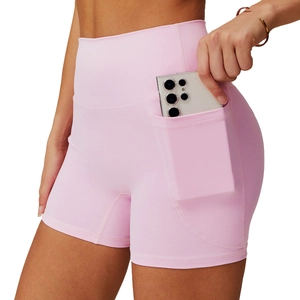 Pink high-waisted yoga shorts with side pockets in quick-dry breathable fabric