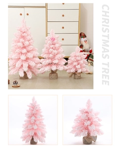 Detailed view of pink flocked Christmas trees in three sizes with rustic burlap bases