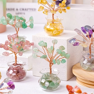 Natural crystal money tree with colorful stone leaves and copper wire in a glass jar