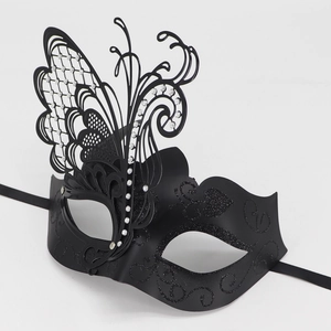 Detailed view of black metal butterfly masquerade mask with sparkling rhinestones