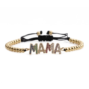 Adjustable gold beaded bracelet with colorful zircon MAMA letters on white background