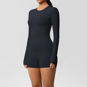 Detail of black double-sided brushed long-sleeve top and yoga shorts set with slim fit