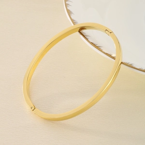 Minimalist 18k gold plated titanium steel oval bangle with smooth polished surface