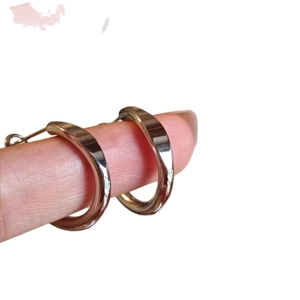 Minimalist chunky gold hoop earrings with a polished mirror finish for women