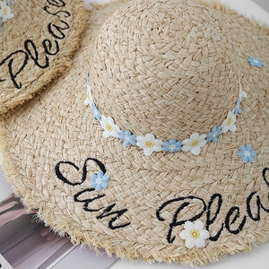 Straw sun hat with Sun Please embroidery, fringe brim, and floral decoration for beach
