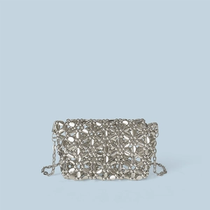 Detailed shot of silver beaded crossbody bag featuring a unique metallic chainmail texture