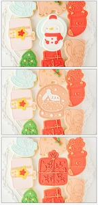 Macro view of Christmas sugar cookies in snowman and reindeer shapes on a plate