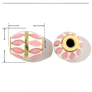 Macro detail of oval stainless steel bead with pink and white enamel flower patterns
