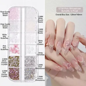 Detail view of 12-grid nail art kit with pink pearls, resin butterflies and rhinestones