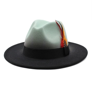 Felt jazz hat featuring a green and black gradient with a decorative feather detail