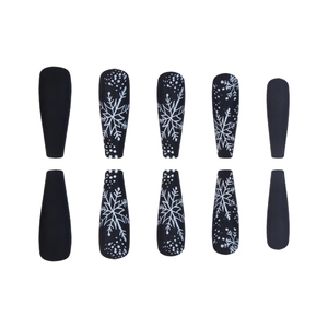 Long coffin matte black press-on nails with white snowflake and polka dot winter design