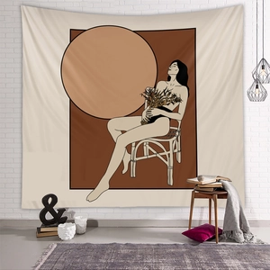 Detail of artistic line art wall tapestry featuring a woman silhouette on white brick wall