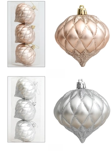 Detail of champagne and silver onion-shaped Christmas ornaments with glitter finish