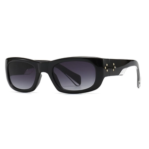 Square black sunglasses with gradient lenses and star-shaped metallic stud details