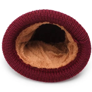 Thick burgundy winter knit hat with warm plush lining for cold weather protection