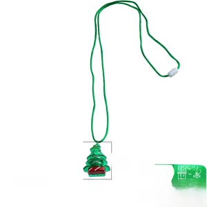 Detailed view of green Christmas tree pendant necklace with 33 inch woven cord strap