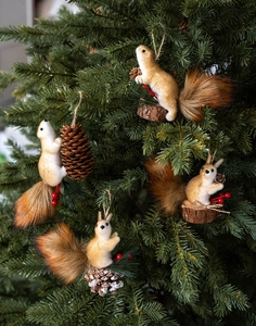 Detailed plush squirrel Christmas tree ornaments with pine cones and red berries on branches