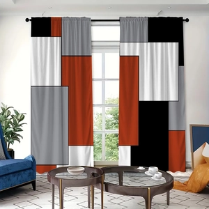 Detail of modern geometric block pattern curtains in orange, grey and white polyester fabric
