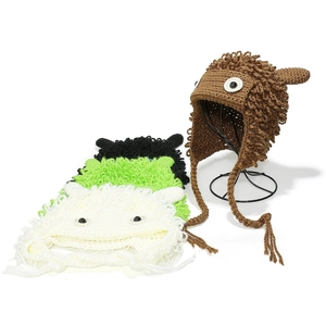 Detail of colorful handmade crochet monster hats with quirky eyes and knitted textures
