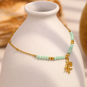 Elegant 18K gold plated necklace with green beads and a coral-shaped pearl pendant