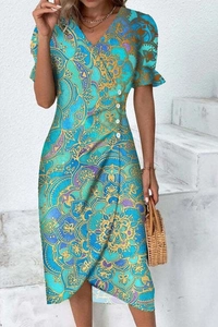 Detail of V-neck puff sleeve dress with golden mandala pattern and side buttons