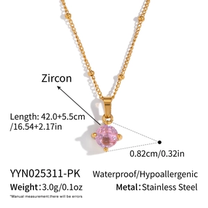 Detail view of golden stainless steel necklace with pink zircon and dimension parameters