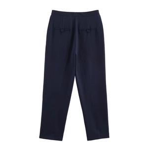 Detailed back view of dark blue dress pants featuring decorative buttoned welt pockets