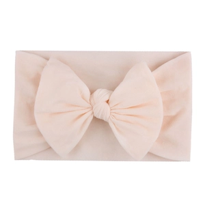 Soft nylon infant headband featuring a large light pink bow for baby girls' cute accessory