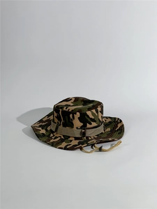 Detail view of woodland camouflage boonie hat with vent holes and adjustable chin strap