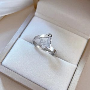Minimalist silver butterfly titanium steel ring with matte wings and small zircon accent