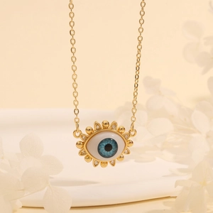 Macro detail of the evil eye pendant featuring blue iris and sparkling zircon stones