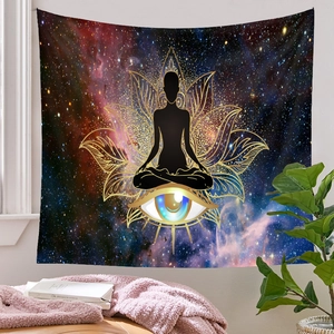 Cozy home decor view featuring meditation tapestry with starry galaxy and lotus patterns