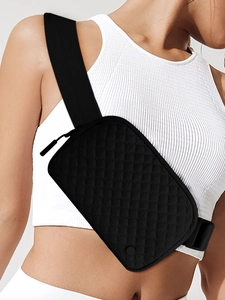 Detail of adjustable woven strap and black quilted waterproof nylon belt bag for sports
