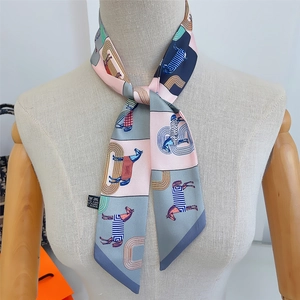 Macro detail of silk plaid horse scarf twilly tied on neck showing material and pattern