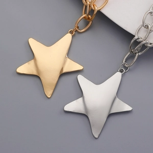 Chic geometric star pendant necklace in gold and silver finish with thick chain links