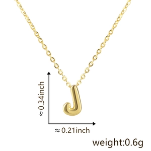 Detail view of gold letter J pendant necklace showing dimensions 0.34 by 0.21 inch
