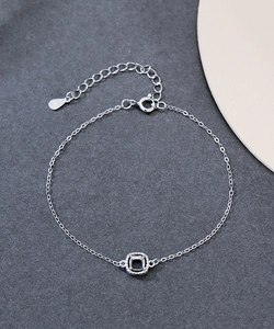 Macro shot of S925 sterling silver bracelet with adjustable clasp and zircon charm