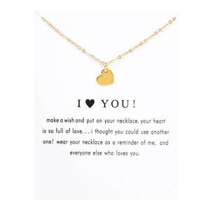 Detailed view of a gold heart pendant necklace on an I Love You message gift card