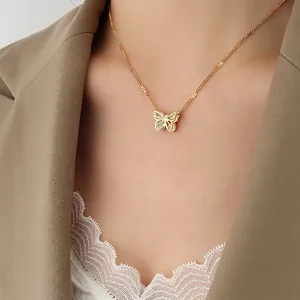 Elegant 18K gold plated butterfly pendant necklace with white zircons on female model