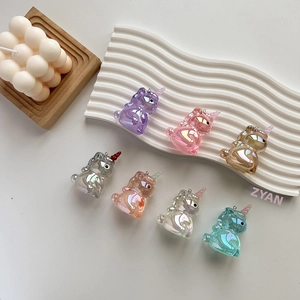 Iridescent acrylic unicorn charms in seven pastel colors with metal rings for DIY crafts