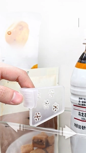 Detail showing the snap-on installation of translucent frosted fridge dividers
