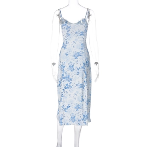 Detail of slim strap floral maxi dress with blue porcelain print on white background