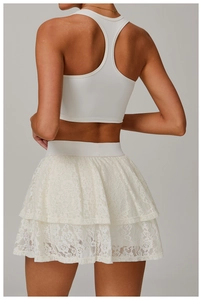 Detailed back view of white lace tiered skirt and high-elastic yoga tank top set