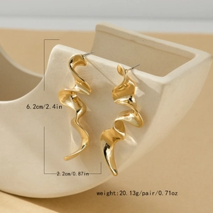 Detail view of twisted gold spiral earrings with dimensions 6.2cm by 2.2cm
