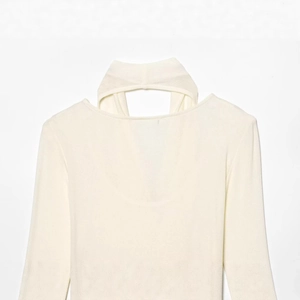 Creamy white double-layer long sleeve knit top with a unique cutout halter neckline