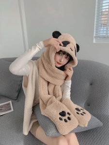 Close-up of plush panda hooded scarf set featuring cute ears and embroidered paw gloves