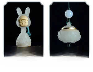 Macro detail of rabbit and lotus incense pouch pendants with ornate metal bases