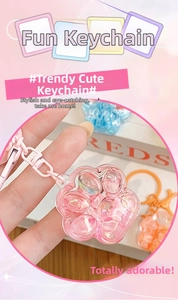 Detail of colorful resin cat paw keychains with floating liquid and glitter sequins