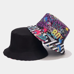 Detail showing dual-sided design with plain black and vintage 80s graffiti printed canvas